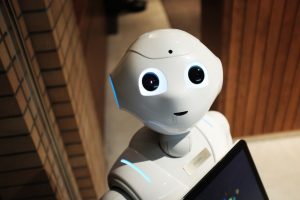 A futuristic humanoid robot in an indoor Tokyo setting, showcasing modern technology